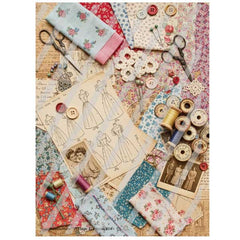 Scattered sewing materials including fabric, buttons, and scissors on a textured surface.