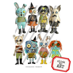 A set of eight handmade, whimsical rag doll costumes styled in Halloween themes. The costumes feature various quirky designs including a blue rabbit, a witch with a skeleton, a zombie, a werewolf, a mummy, a bee, a rabbit with striped shirt, and a girl with orange yarn hair.