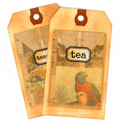 Two tea bags with a parrot design and 'tea' label on a white background.