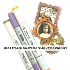 Wooden frames with a vintage portrait and Copic Markers on a white background