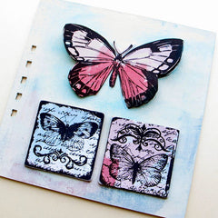 butterfly rubber stamped book page